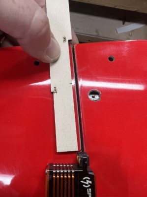 The tool shows using the notch marked &quot;B&quot; to place the servo in the wing as referenced from the TE flat at the center.