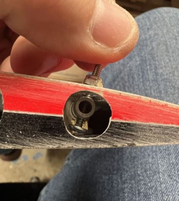 Partially tighten the 4-40 bolt and nylon insert nut as shown.  Note the screw is angled backwards to allow for the white plastic flag to centered on the hinge line.  I do not use differential.