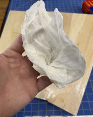 Wipe the foam core with a damp paper towel.  Water provides the dampness.  Seems to help the Gorilla glue kick.  DO NOT wipe the balsa.  Just wipe the foam with the damp paper towel.