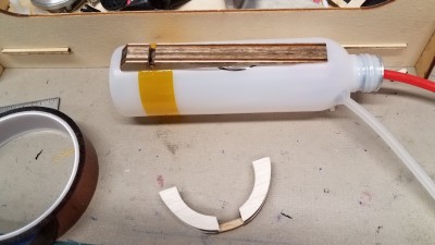 The aft end of the tank has been protected with kapton tape and the wedge glued to the top. (This is a wedge from a different plane because the wedge for the MFL is taller.)