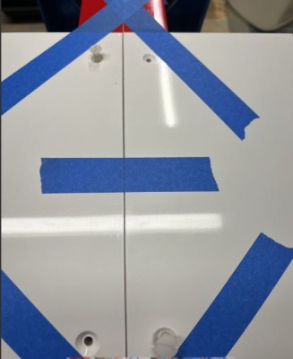 I drill and tap one hole at a time.  Start in the rear then opposite corner front.  Install screws after tapping prior to moving onto the next hole.  Continue this process until all 4 holes are drilled and tapped.