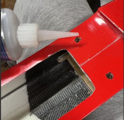 remove the wing and fill the holes with thin CA.  Once the CA is dry, RE-TAP the holes prior to installing the wing.