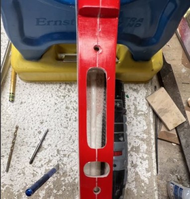 I cut an additional hole between the bolts to make sure the pushrods are not crossed during assembly.