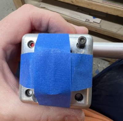 Drill through your mount starting in the top right as shown and install a 6-32 screw.