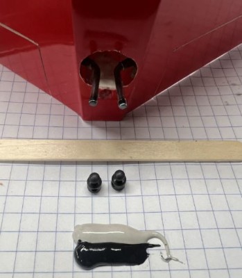 Use JB weld to secure the balls to the V-Tail torque rods.  Clean the threads first with alcohol.