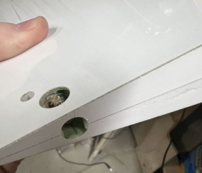 Clean up the hole in the bottom skin to allow for the nut and tool to be used to secure the vertical component of the torque rod.  In addition open up a hole at the root to allow for JB weld to be added during the installation process.
